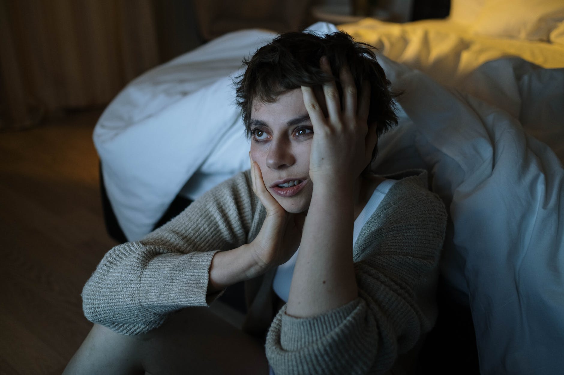 photograph of a woman touching her face due to Health Anxiety Disorder