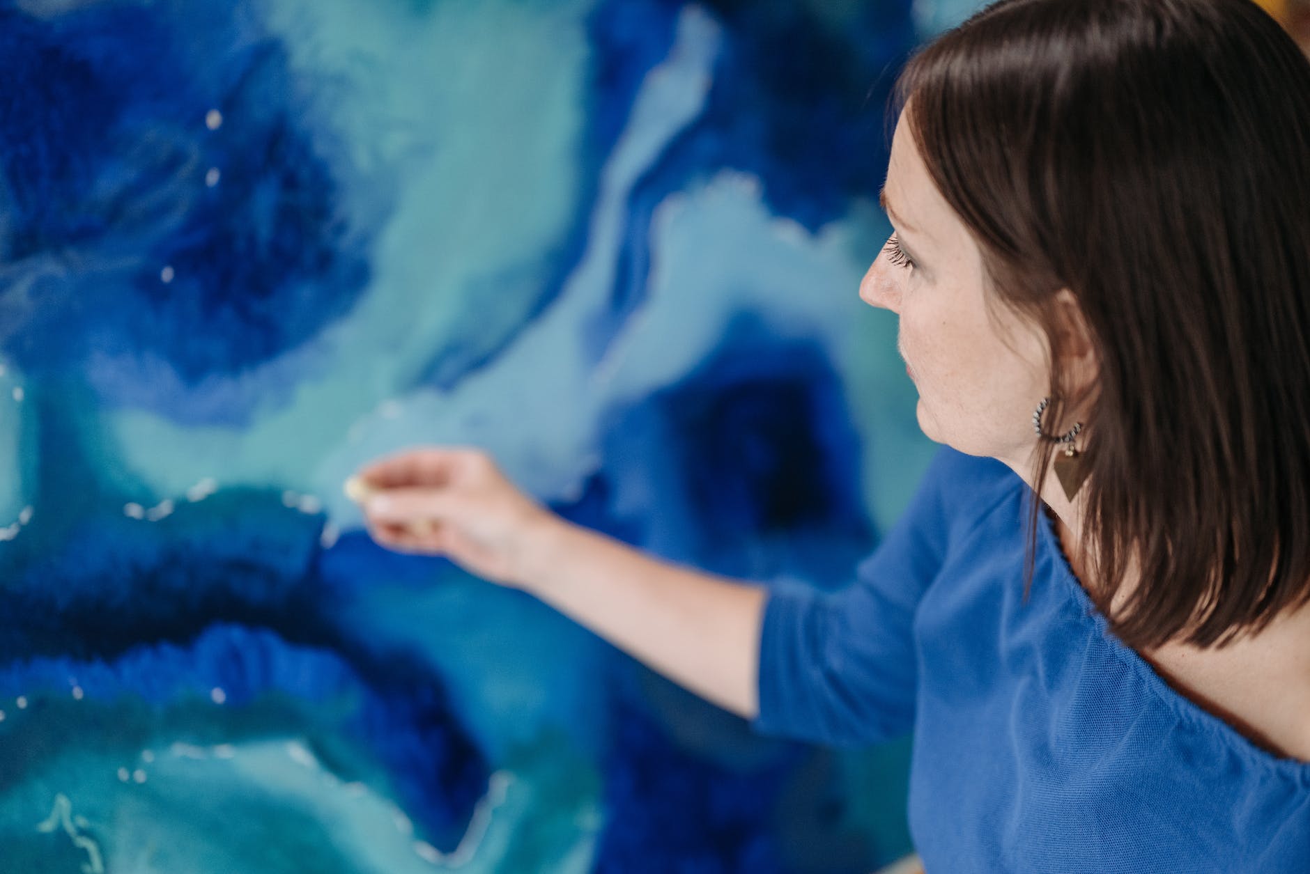 woman using oil pastels